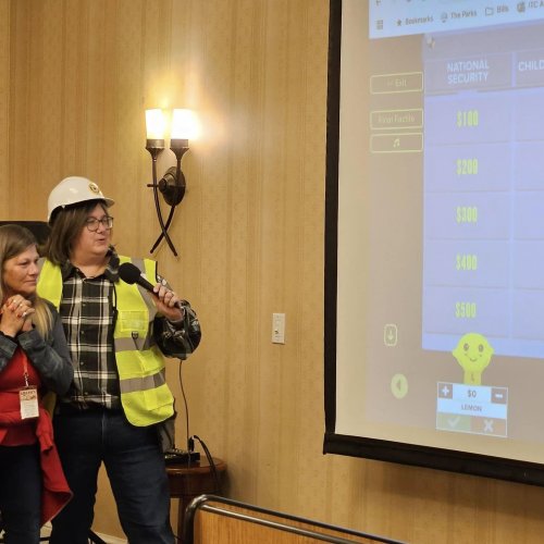 1-17-25 - DEC in Palmdale - Program Fair - National Security and Community Service host a game of Jeopardy while the audience sings the theme song, doot doot doot doot...